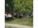 Charming home with a well-maintained front yard and mature trees at 1311 Flintlock Dr, Greenwood, IN 46143