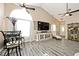 Bright living room with vaulted ceilings, wood-look floors, and large windows at 1311 Flintlock Dr, Greenwood, IN 46143