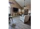 Inviting living room with vaulted ceiling, new floors, lots of light and ceiling fans at 1311 Flintlock Dr, Greenwood, IN 46143