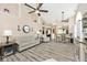 Spacious living area featuring vaulted ceilings, modern furnishings, and wood-look flooring at 1311 Flintlock Dr, Greenwood, IN 46143