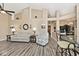 Well-lit living room boasting vaulted ceilings, stylish decor, and modern wood-look floors at 1311 Flintlock Dr, Greenwood, IN 46143