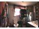 Compact bathroom featuring a toilet, sink, and water heater at 1325 N Gavin St, Muncie, IN 47303