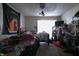 Interior shot of an unkempt bedroom with clutter and a doorway to the exterior at 1325 N Gavin St, Muncie, IN 47303