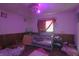 Interior shot of a disorganized bedroom with a crib and toys at 1325 N Gavin St, Muncie, IN 47303