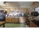 Functional kitchen with wood cabinets and essential appliances at 1325 N Gavin St, Muncie, IN 47303