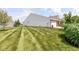 Expansive backyard with lush green grass, showcasing the generous lawn space at 13427 Merryvale St, Fishers, IN 46037