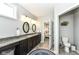 Bathroom with granite countertops, dual sinks, and access to the toilet room at 13427 Merryvale St, Fishers, IN 46037