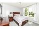 Bright bedroom with a large window that provides natural light, and a comfortable aesthetic at 13427 Merryvale St, Fishers, IN 46037