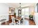 Charming dining area features a modern chandelier and classic decor at 13427 Merryvale St, Fishers, IN 46037