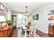 Formal dining room boasts elegant chandelier and lovely natural light from the window at 13427 Merryvale St, Fishers, IN 46037