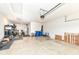 Spacious garage with concrete floor, organized storage, and ample room for parking at 13427 Merryvale St, Fishers, IN 46037