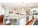 Bright kitchen with a large central island, stainless appliances and a seamless design at 13427 Merryvale St, Fishers, IN 46037