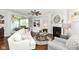 Bright living room boasts a fireplace, stylish furnishings, and an open layout at 13427 Merryvale St, Fishers, IN 46037