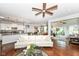 Open-concept living room flowing into the kitchen and sunroom, perfect for entertaining at 13427 Merryvale St, Fishers, IN 46037