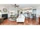 Open-concept living room featuring a fireplace and seamless flow into the kitchen at 13427 Merryvale St, Fishers, IN 46037