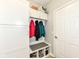 Functional mudroom with built-in storage, bench, and coat hooks for an organized entryway at 13427 Merryvale St, Fishers, IN 46037