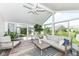 Inviting sunroom with comfortable seating, and plenty of natural light at 13427 Merryvale St, Fishers, IN 46037