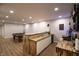 A finished basement bar features a sink, wood countertop, white cabinets, pool table and lights overhead at 14404 Stairbridge Pl, Carmel, IN 46074