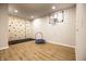 Finished basement featuring a rock climbing wall, trampoline, and basketball hoop for Gathering fun at 14404 Stairbridge Pl, Carmel, IN 46074