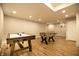 Spacious finished basement featuring air hockey, foosball table, and basketball hoop, perfect for Gathering entertainment at 14404 Stairbridge Pl, Carmel, IN 46074