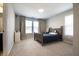 This bedroom features a bed with a wood frame and a window with a blind and curtains, with white walls at 14404 Stairbridge Pl, Carmel, IN 46074