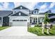Beautiful two-story home featuring manicured lawn, neutral paint, attached two-car garage, and charming curb appeal at 14404 Stairbridge Pl, Carmel, IN 46074