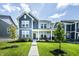 Charming two-story home with a well-manicured lawn, inviting porch, and modern design at 14404 Stairbridge Pl, Carmel, IN 46074