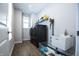 Functional laundry room equipped with washer, dryer, utility sink, and storage shelves at 14404 Stairbridge Pl, Carmel, IN 46074