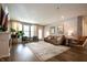 Bright living room with a fireplace, a cozy seating area, and a hanging chair at 14404 Stairbridge Pl, Carmel, IN 46074