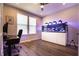 Well-lit home office featuring an aquarium, desk, and ample workspace at 14404 Stairbridge Pl, Carmel, IN 46074