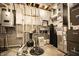 Organized utility room with modern appliances, water heater, and filtration systems for efficient home maintenance at 14404 Stairbridge Pl, Carmel, IN 46074