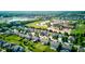 Neighborhood aerial view showcasing the school district, local shopping area, and lush tree-lined streets in this suburban community at 14620 Hinton Dr, Fishers, IN 46037