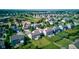 Aerial view of the community showcasing well-manicured lawns, varied home styles, and mature trees at 14620 Hinton Dr, Fishers, IN 46037