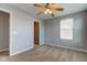 Cozy bedroom with neutral carpet, a ceiling fan, and a window letting in natural light at 14620 Hinton Dr, Fishers, IN 46037