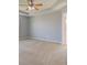 Spacious bedroom with ceiling fan and neutral carpet and paint, bright and airy at 14620 Hinton Dr, Fishers, IN 46037