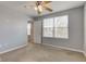Comfortable bedroom featuring neutral carpet, ceiling fan, and a bright window at 14620 Hinton Dr, Fishers, IN 46037