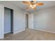 Neutral painted bedroom with ceiling fan, closet and access to a bathroom at 14620 Hinton Dr, Fishers, IN 46037