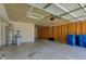Spacious garage interior featuring water softener and heater, blue recycling bins, and wooden framing at 14620 Hinton Dr, Fishers, IN 46037