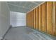Unfinished garage interior showing the wooden frame, concrete flooring, and exposed drywall at 14620 Hinton Dr, Fishers, IN 46037