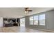 Open concept living space with kitchen view showcasing dark cabinets, stainless steel appliances, and breakfast bar at 14620 Hinton Dr, Fishers, IN 46037