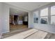 Open-concept living area features wood-look floors, staircase, and bright windows at 14620 Hinton Dr, Fishers, IN 46037