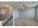 Upstairs loft area boasts neutral carpet, ceiling fan, and ample natural light at 14620 Hinton Dr, Fishers, IN 46037