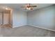 Upstairs loft features carpet, ceiling fan, and neutral paint near the bedroom and bathroom at 14620 Hinton Dr, Fishers, IN 46037