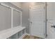 Practical mudroom with built-in bench, storage cubbies, and a door at 14620 Hinton Dr, Fishers, IN 46037