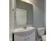 Cozy powder room featuring a vanity sink, mirror, and toilet at 14620 Hinton Dr, Fishers, IN 46037