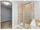 Bathroom shower with glass doors and decorative tile at 14620 Hinton Dr, Fishers, IN 46037