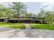 Stunning front exterior with meticulous landscaping and a spacious driveway at 1616 W 116Th St, Carmel, IN 46032