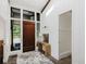 Bright foyer featuring a wooden door, modern decor, and natural light at 1616 W 116Th St, Carmel, IN 46032