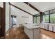 Open-concept kitchen boasts an island and updated appliances, perfect for culinary enthusiasts and entertaining at 1616 W 116Th St, Carmel, IN 46032
