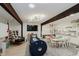 Well-lit playroom featuring wood beam, a variety of activities, cozy seating, and educational resources at 1616 W 116Th St, Carmel, IN 46032